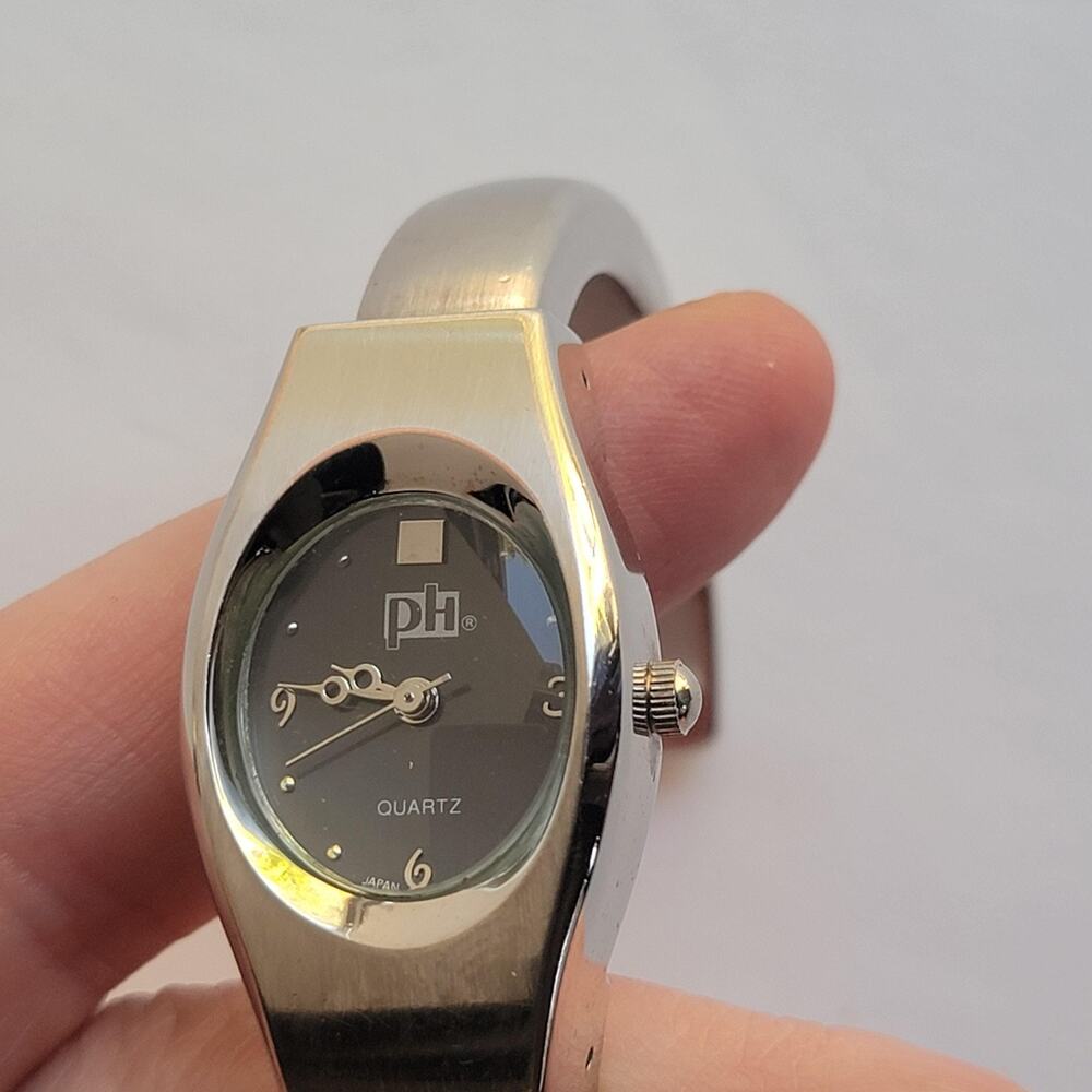 PH Womens Watch Black Dial Silver Case Stainless Bangle Tonneau Quartz
